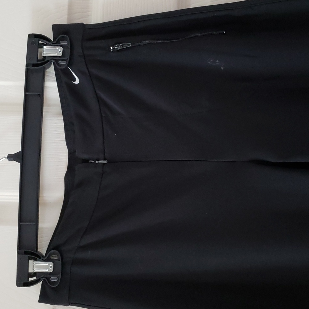 Nike straight leg, front zip pants, size medium.  Fits like small.